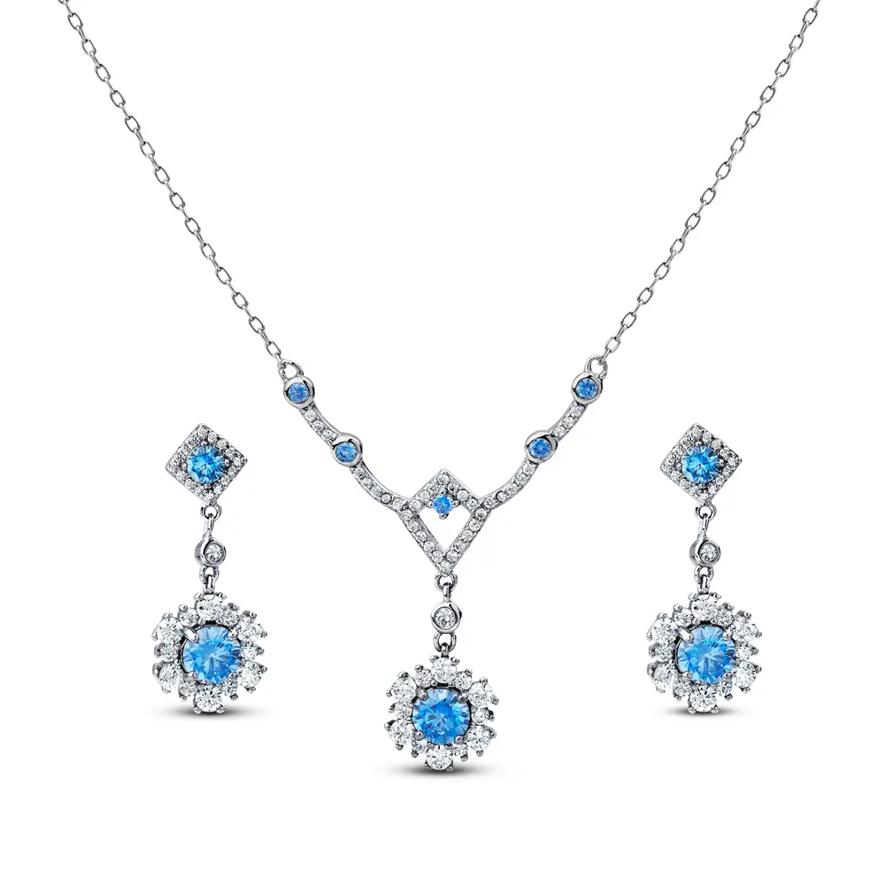 Conjunto Prata Rodinada Flor Cravejada com Zircônias Azuis